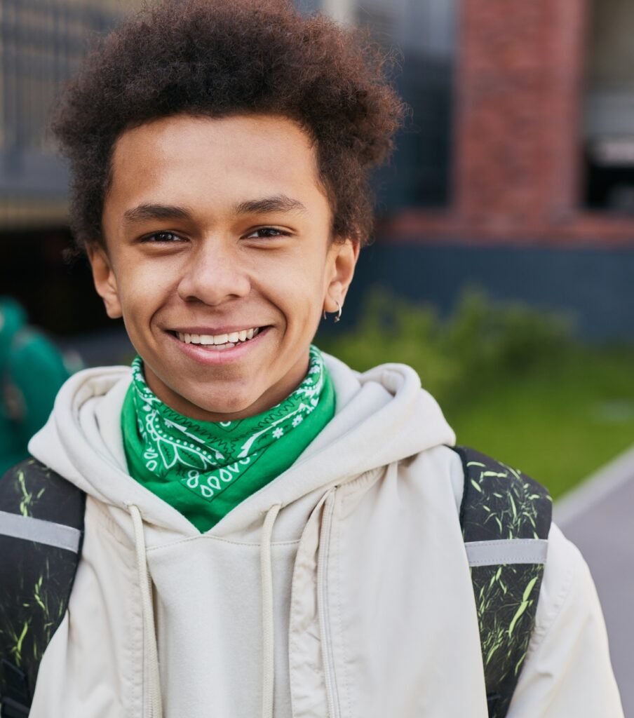 https://safelyinsure.net/wp-content/uploads/2025/07/african-teenage-student-standing-outside-e1753451689609-904x1024.jpg