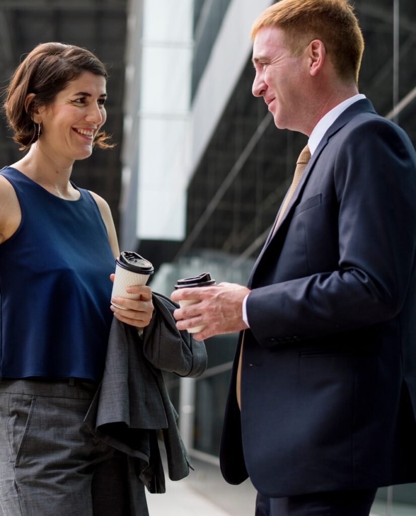 https://safelyinsure.net/wp-content/uploads/2025/07/businesspeople-talking-together-before-a-trip-e1753451644774-825x1024.jpg
