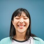 Portrait of young Asian girl smiling at camera