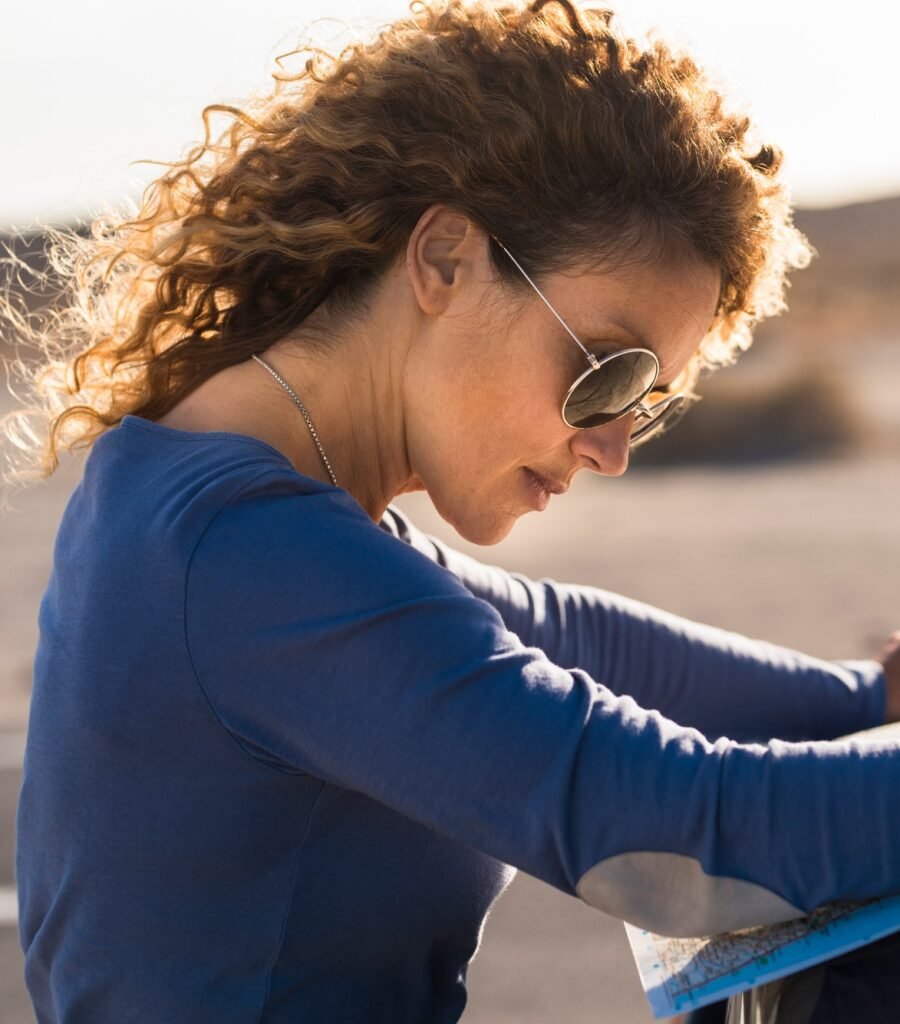 https://safelyinsure.net/wp-content/uploads/2025/07/single-woman-enjoy-travel-adventure-reading-map-on-the-car-outdoor-on-the-road-adult-female-e1753451775952-900x1024.jpg