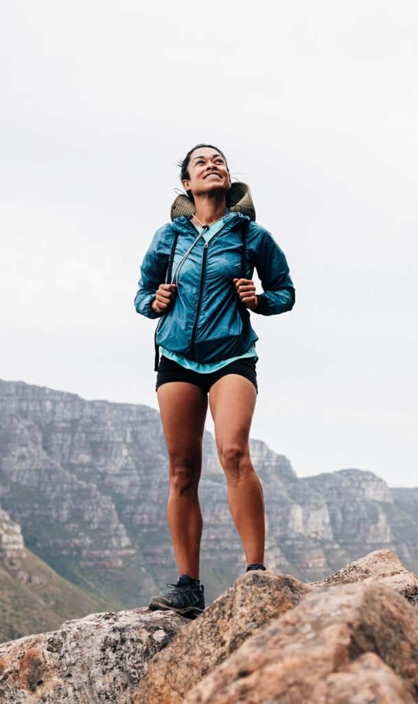 https://safelyinsure.net/wp-content/uploads/2025/07/woman-in-sports-clothes-with-backpack-standing-on-a-rock-and-looking-up-during-mountain-hike-e1753451706347-609x1024.jpg